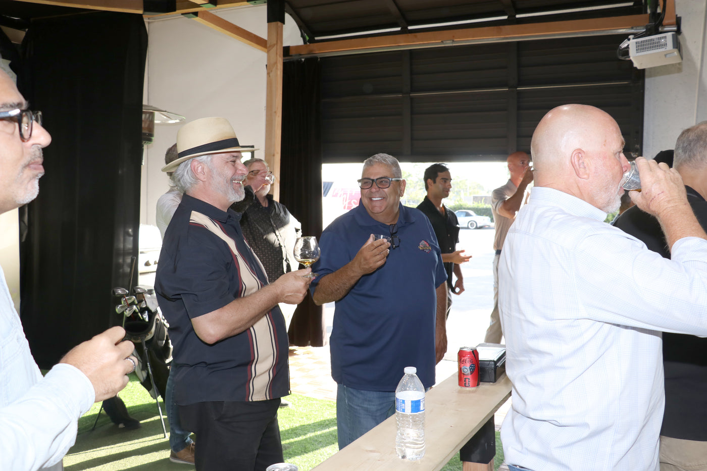 Capitalist Club members talking together during a clubhouse gathering