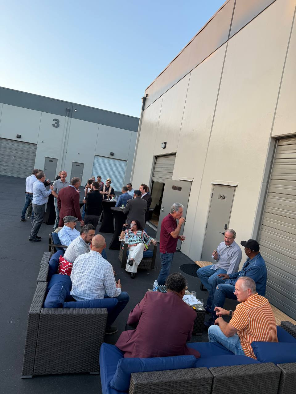 Guests socializing at an outdoor event hosted at Capitalist Club